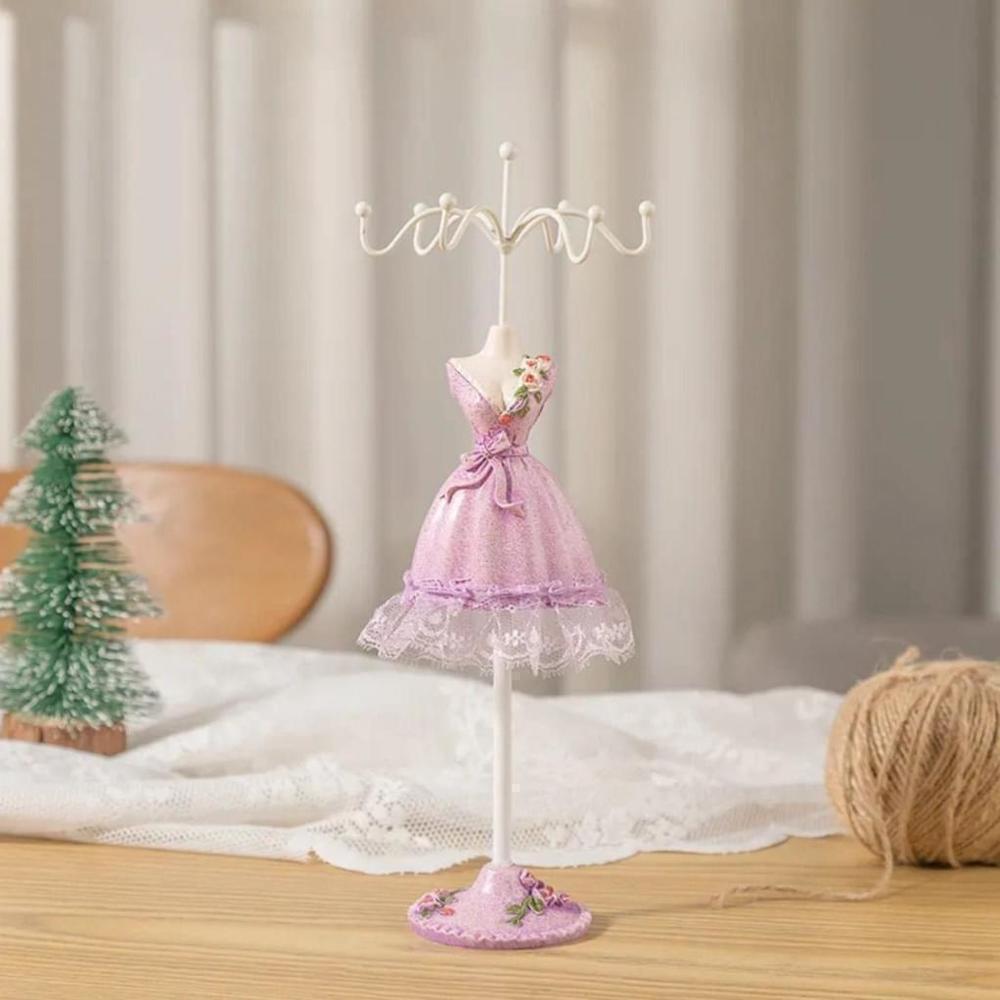 Rotating Jewelry Rack In Long Purple Dress